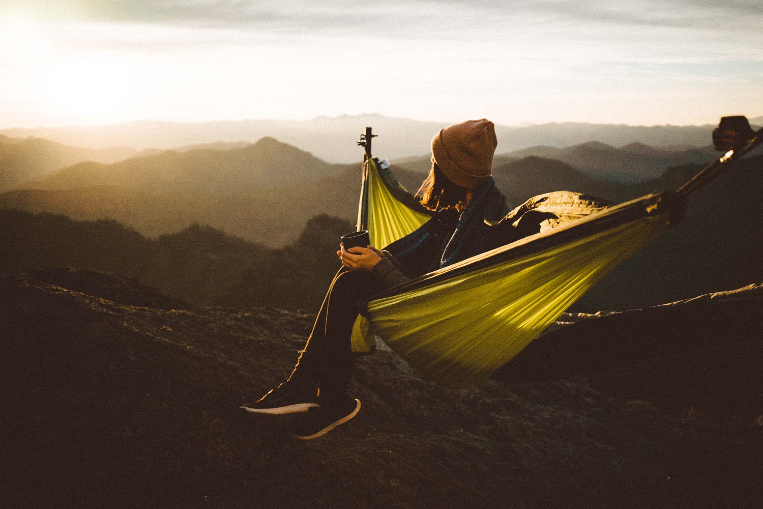 Hiker treating a foot blister on the trail with moleskin and Sting-Less HOCl mist