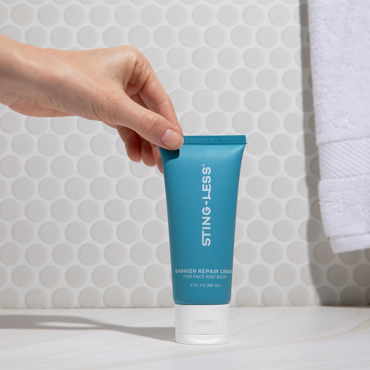 Skin barrier repair cream being applied to forearm