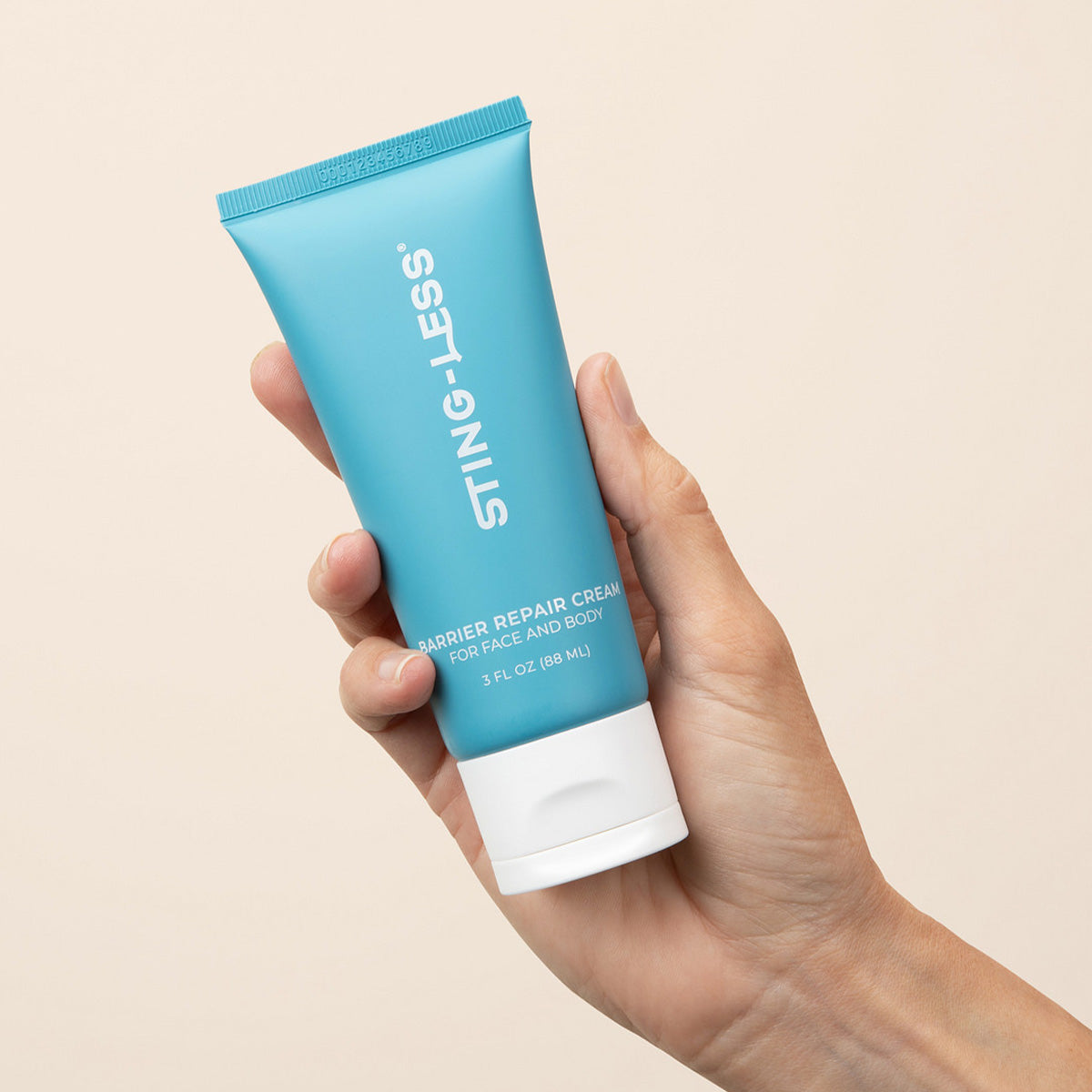Sting-Less barrier repair moisturizer on white background